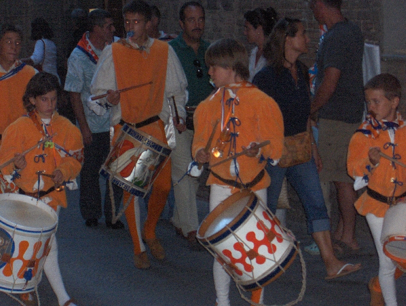 Palio in Siena celebrating in the streets, Italy