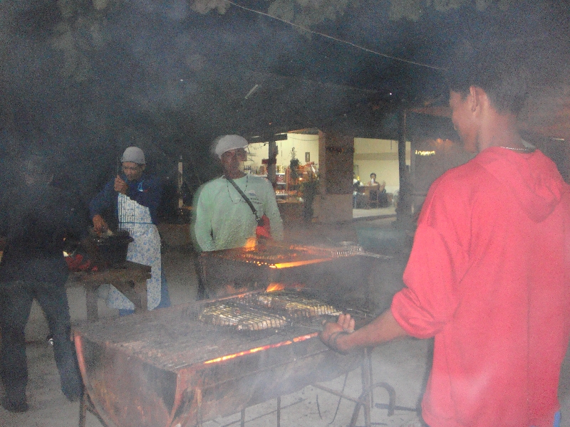 Grilling the fish on the beach, Thailand