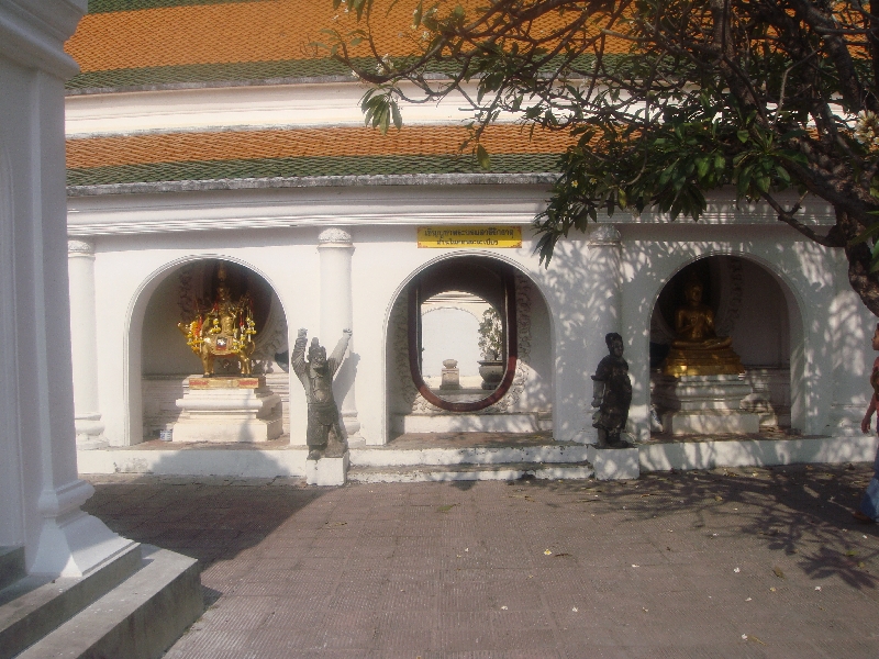 Buddhist Chedi with lined up statues, Thailand