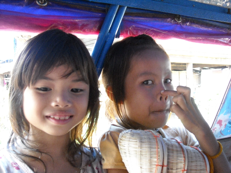 Two Cambodian girls in a tuk tuk, Cambodia