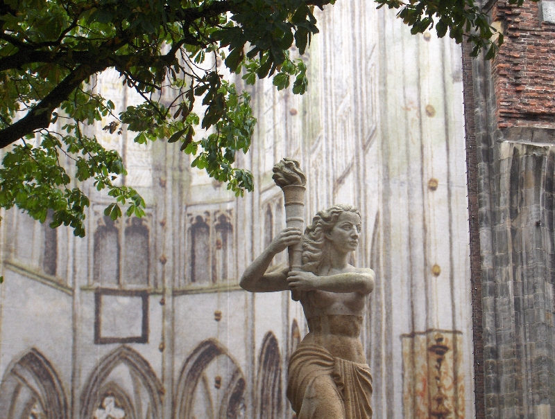 Statue in front of the Tower Din, Utrecht Netherlands