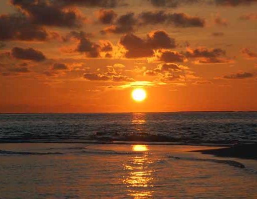 Sunset over Moofushi Resort Ari Atholhu  