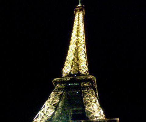 Photo of the Eiffel Tower at night., France