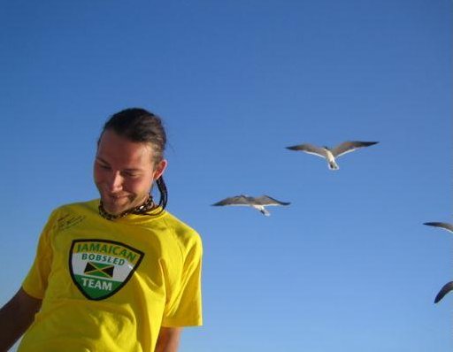 Feeding the hungry birds on the beach in Miami., United States