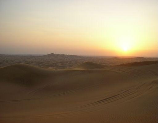 Dubai United Arab Emirates Looking out over the desert at sunset.