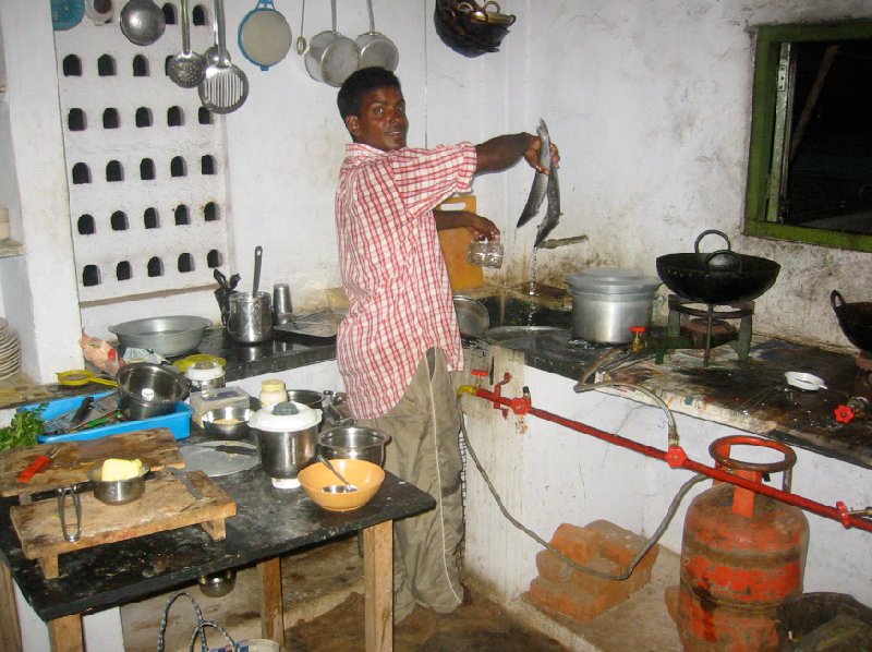 Photo of the houseboat kitchen and our cook., India