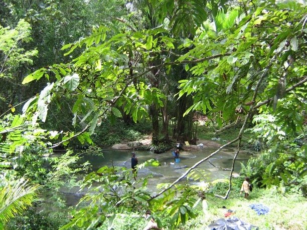 Locals taking a bath at the falls, Papua New Guinea