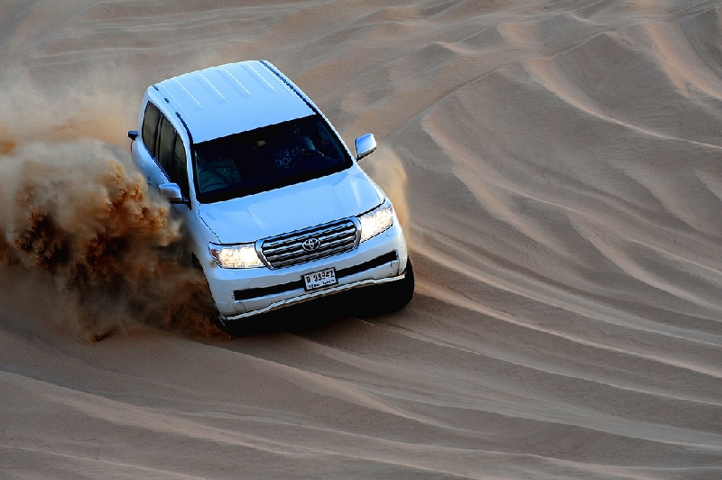 Dubai United Arab Emirates dune basing with other SUV in desert