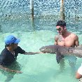 Holding a shark on the Catamaran Tour in Mexico.