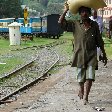 Locals in India walking barefooted at the train station., Kochi India