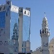 Manama Bahrain Photo of the NBB Tower and the Yateem Mosque in Manama