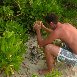 Cracking a coconut before sunset Maldives