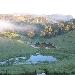 sunrise over the springbrook mountains seen from the garden at Hillcrest Retreat Australia